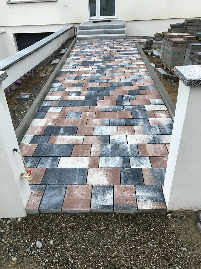 Entreprise de pavage réalisant une cour en pavés granit à Rixheim